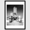 Black and white photograph of an industrial processing structure photographed head-on, shown in a black wooden frame, California