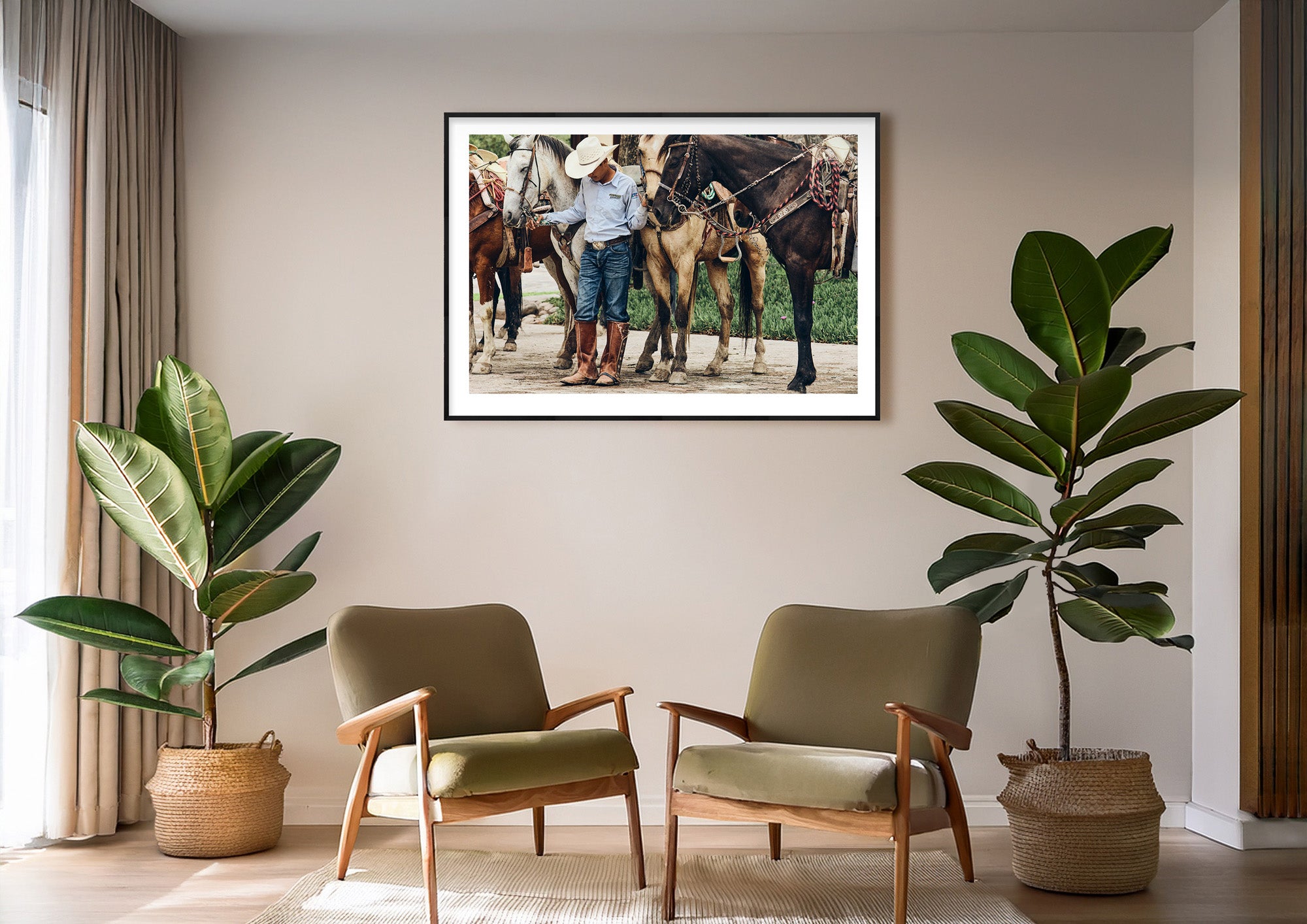 Colour photograph of horses and rider at rest displayed as a framed print in a styled interior setting (mockup)