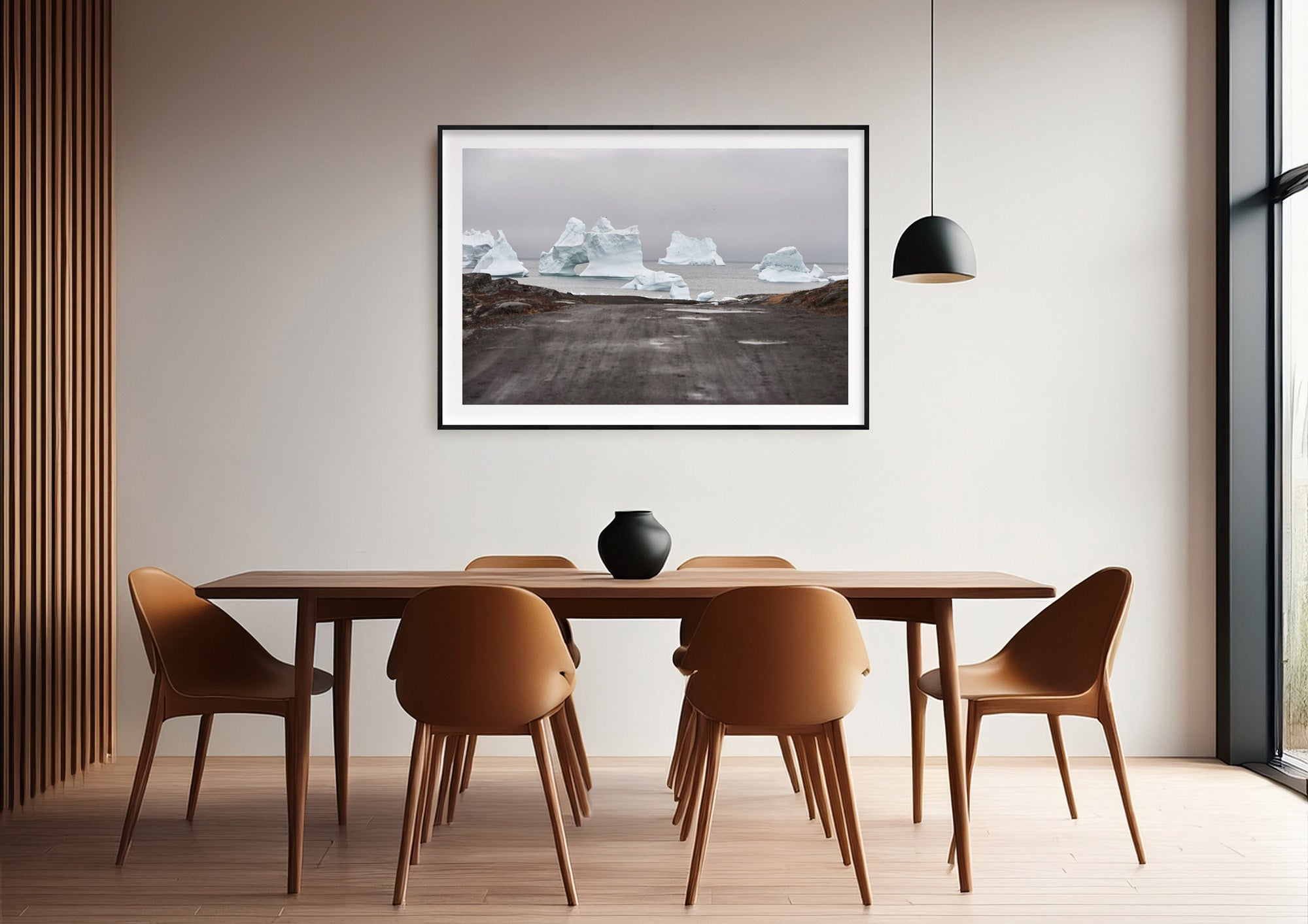 Colour photograph of icebergs beyond a road, displayed in a styled interior setting (mockup)
