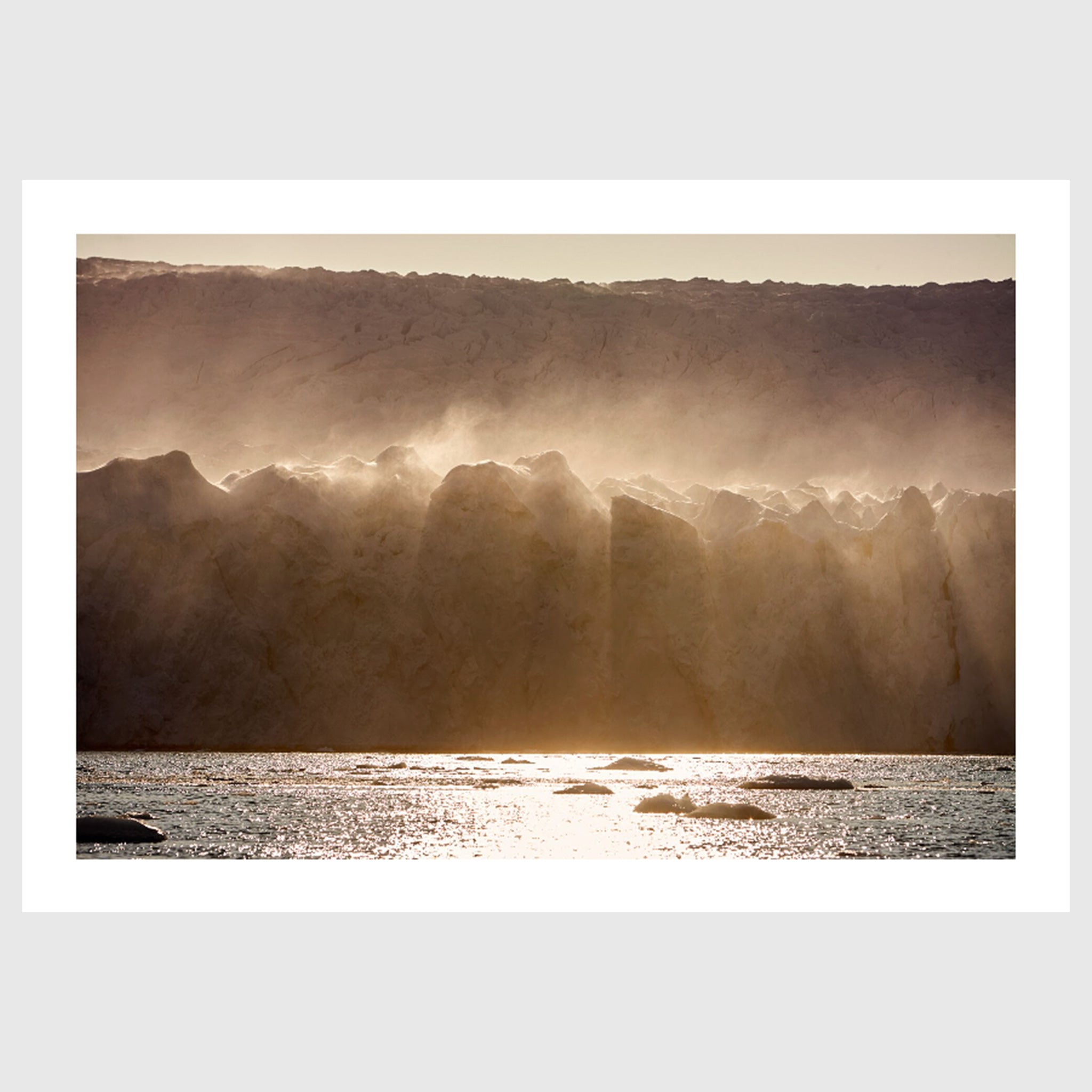 Colour photograph of wind-blown ice formations along a glacier wall, Greenland