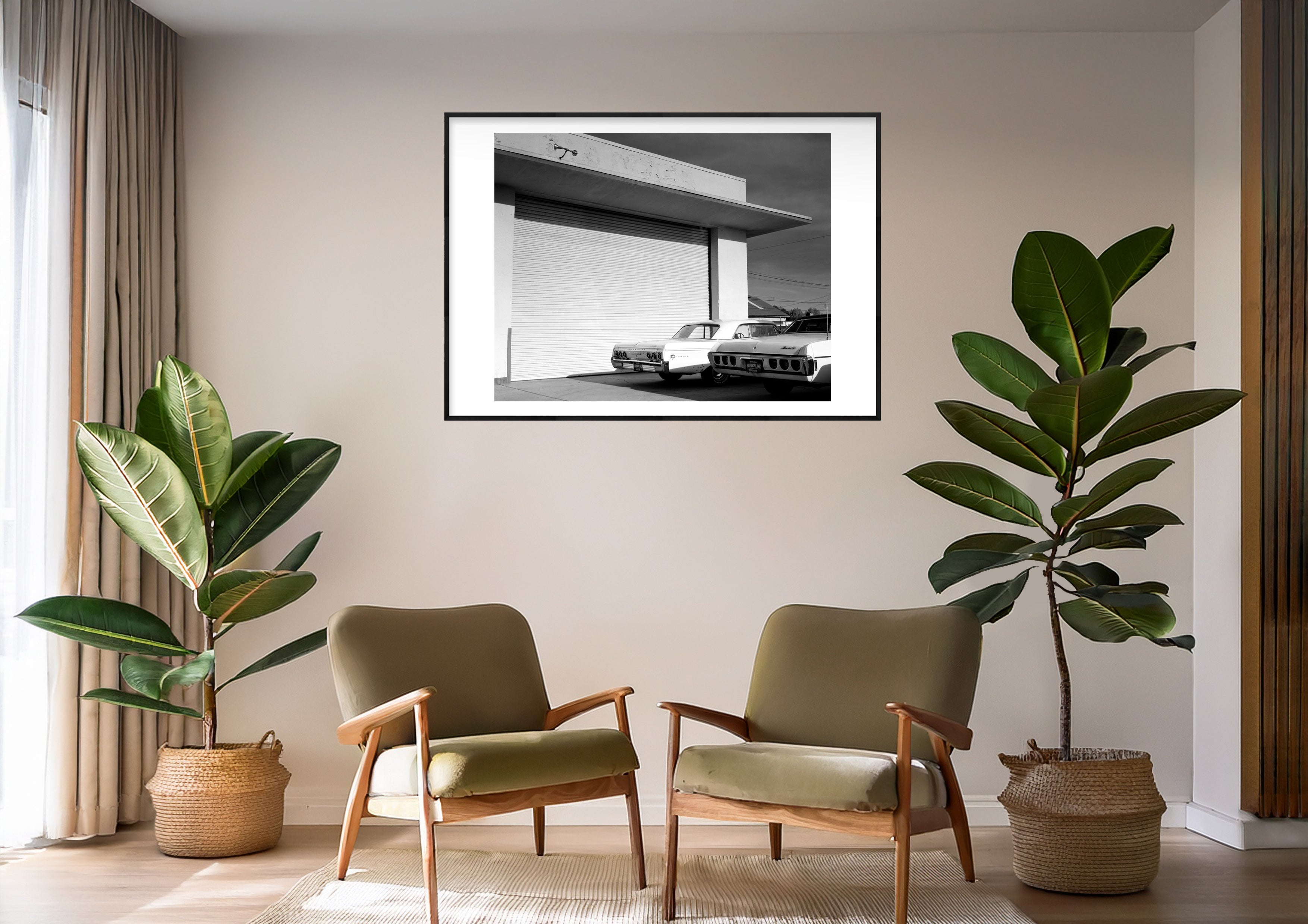 Black and white photograph of parked cars displayed in a styled interior setting (mockup)