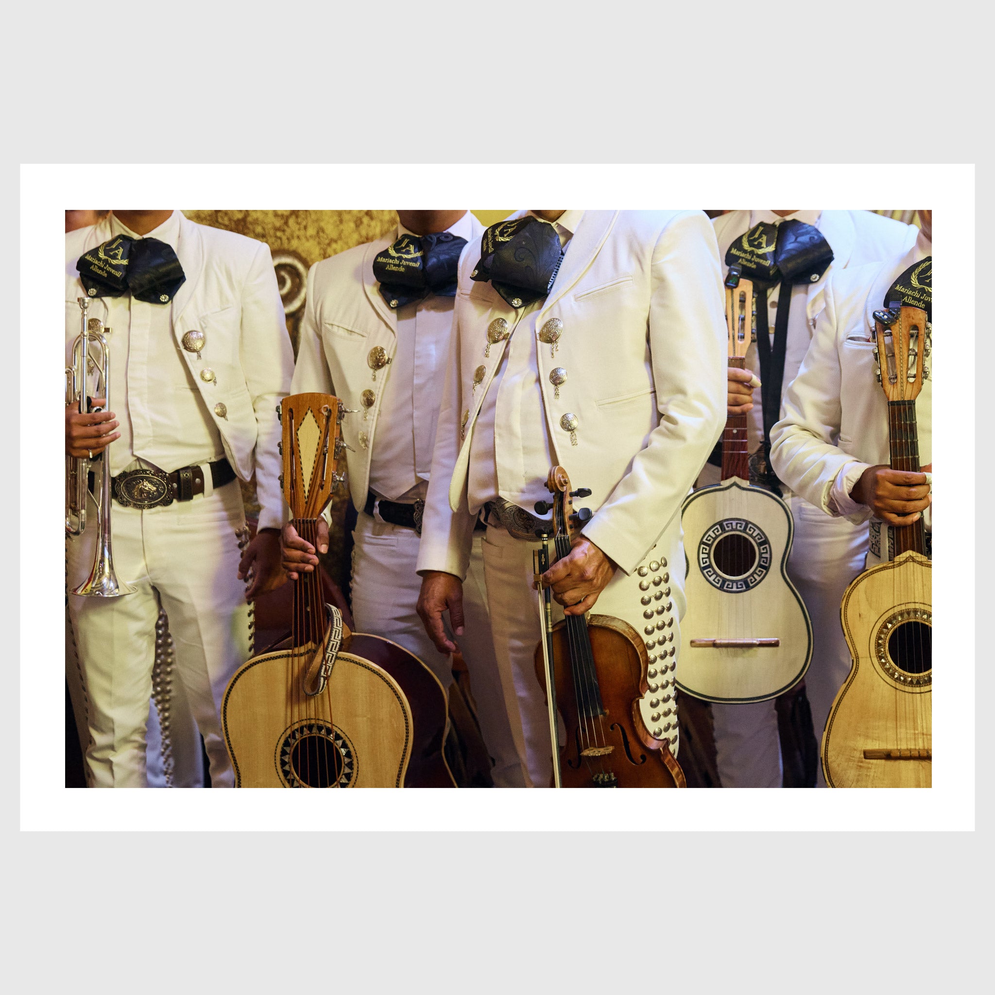 Colour photograph of mariachi musicians wearing traditional white charro suits and holding instruments in San Miguel de Allende, sold as an unframed fine art print
