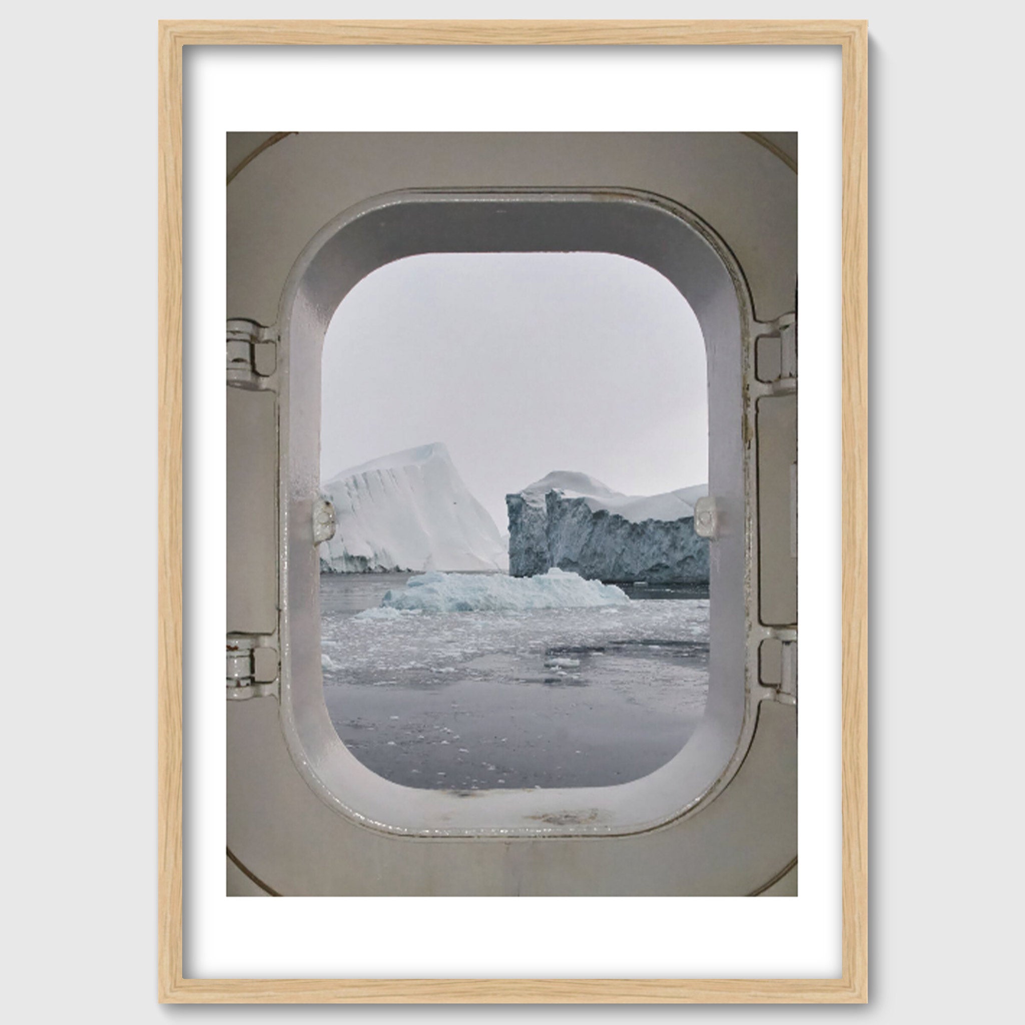 Portal – Icebergs Through a Ship Porthole, Greenland Arctic Photography